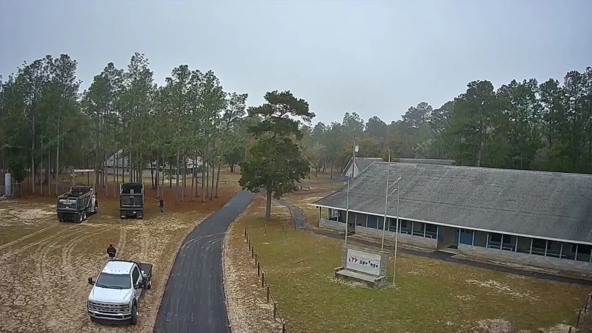 Residential driveway paving in Hudson, FL: aerial view of newly paved asphalt driveways at a home