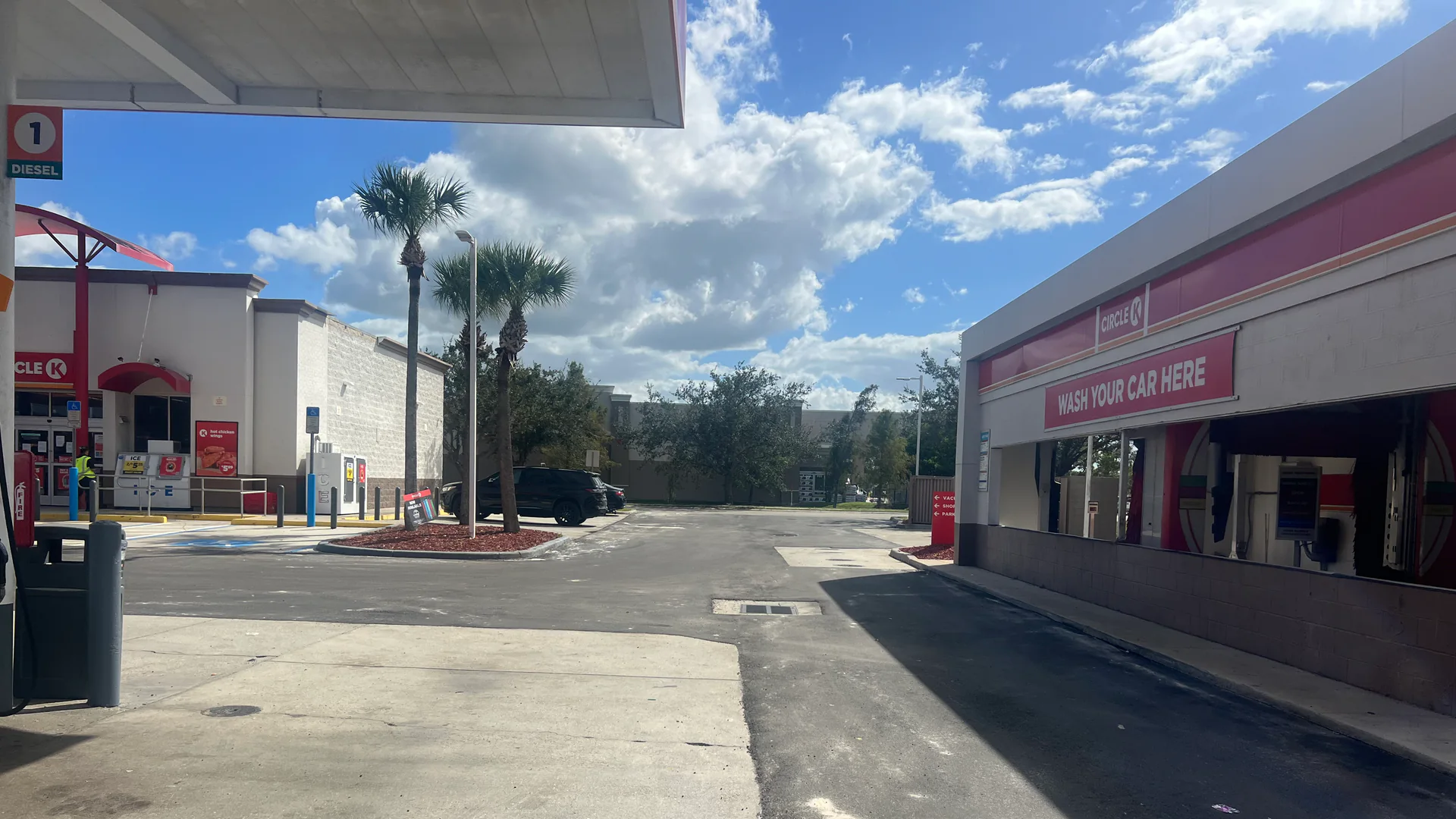 Asphalt repair in Hudson, FL: patched commercial pavement at a car wash entrance
