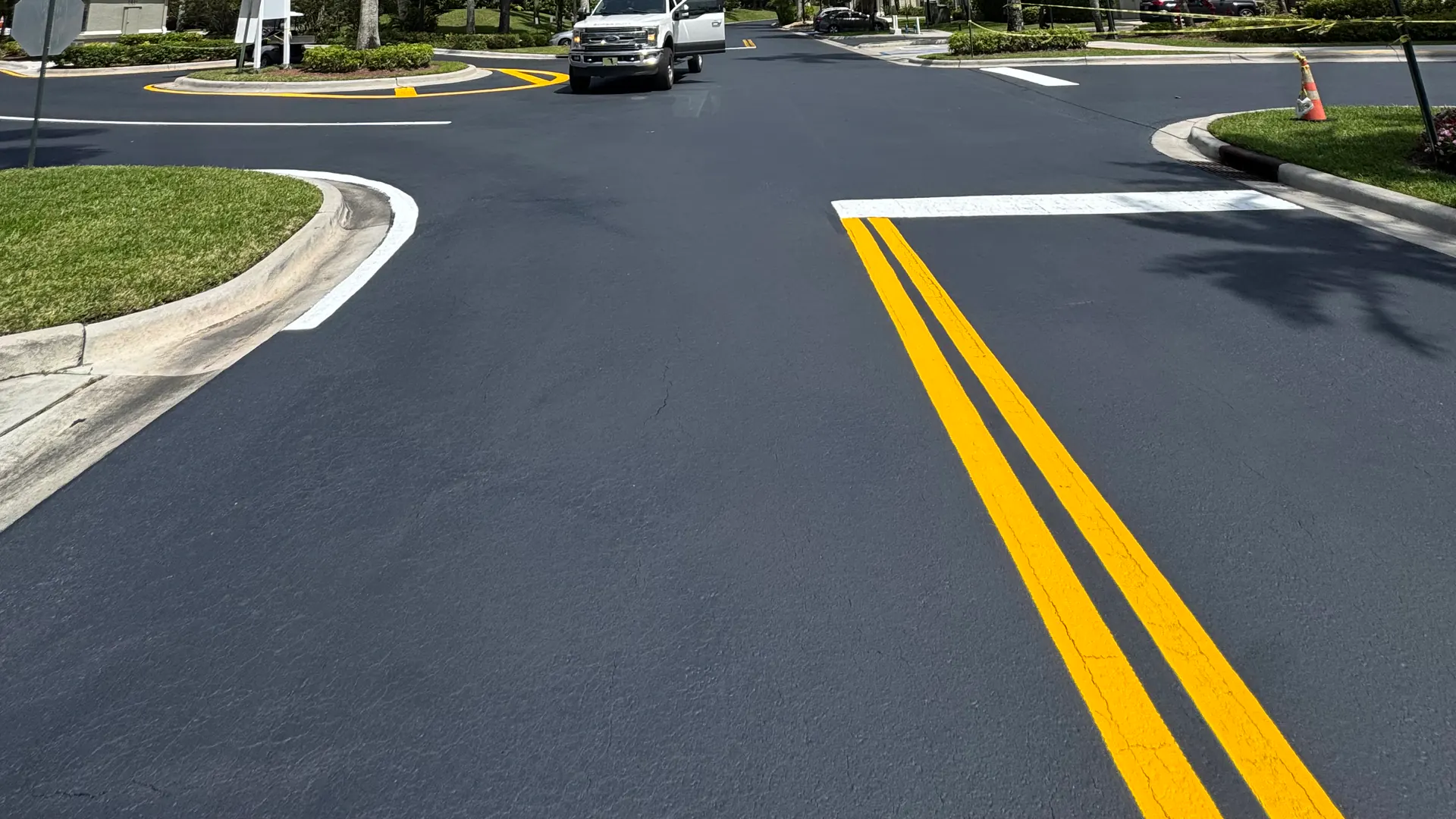 Concrete curbing in Hudson, FL: new concrete curb along a freshly paved and striped asphalt roadway