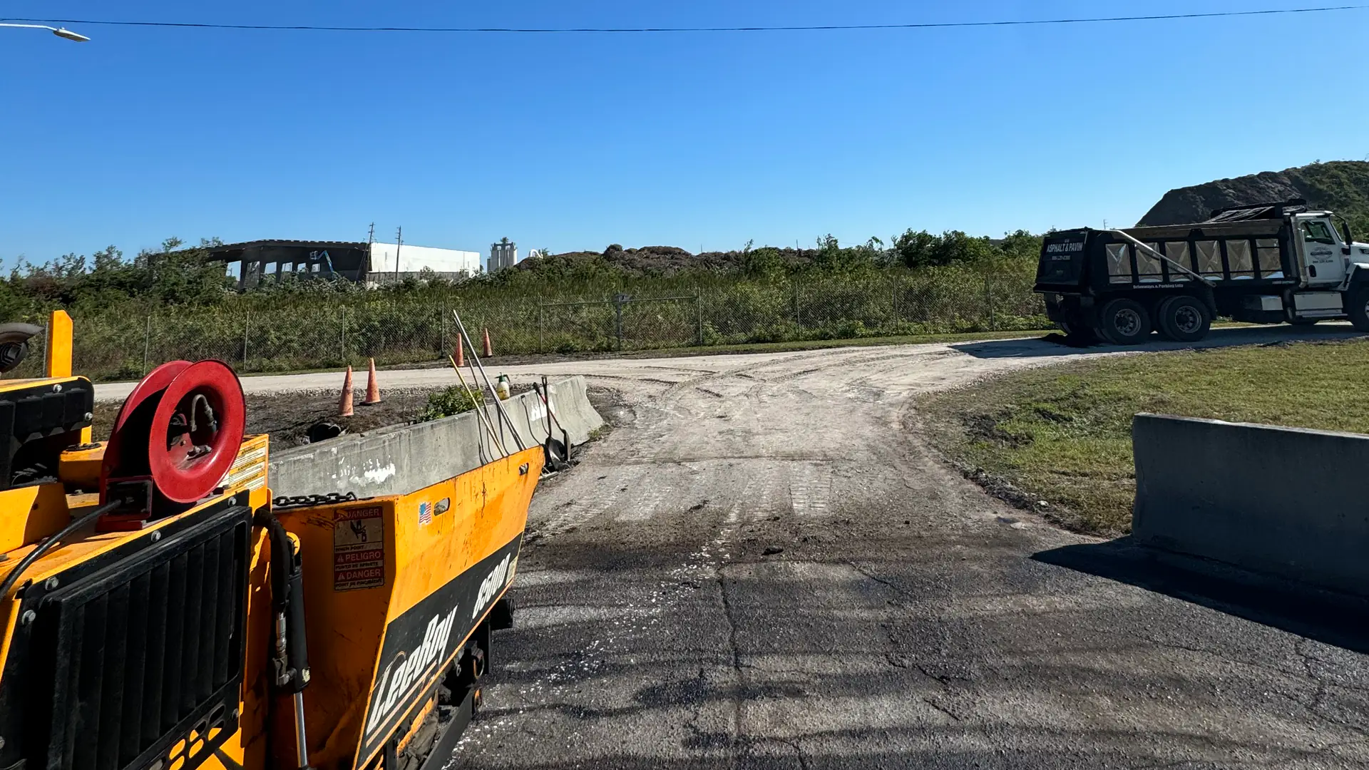 Infrared asphalt repair in Hudson, FL: crew preparing a failed pavement section for seamless heated repair